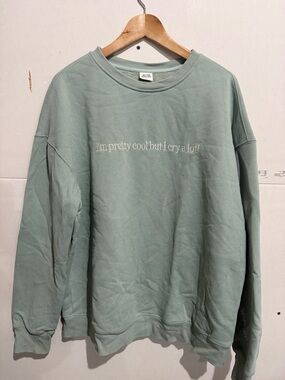 Relaxed Sage Green Crewneck Sweatshirt with Subtle Script